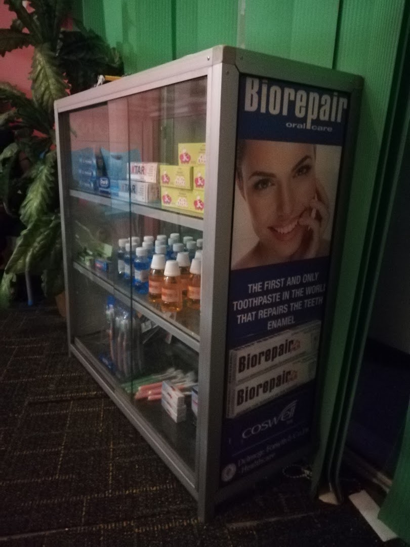 Oral care products displayed in a glass cabinet inside the clinic